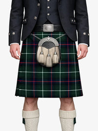 Person wearing a traditional Scottish kilt with a tartan pattern on a white background
