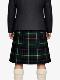 Person wearing a black jacket and green plaid kilt on a white background