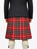 Person wearing a black jacket and red plaid kilt on a white background