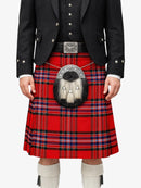 Person wearing a red tartan kilt with a black jacket on a white background