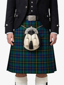 Person wearing a traditional Scottish kilt with a sporran on a white background