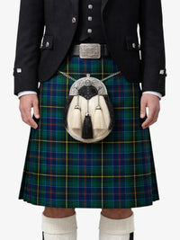 Person wearing a traditional Scottish kilt with a sporran on a white background