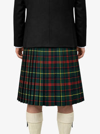 Person wearing a black jacket and green plaid kilt on a white background
