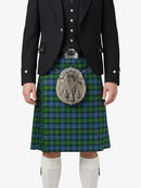 Person wearing a traditional Scottish kilt with a tartan pattern on a white background