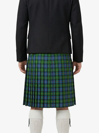 Person wearing a black jacket and green plaid kilt on a white background