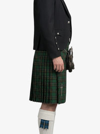 Person wearing a black jacket and green plaid kilt on a white background