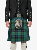 Person wearing a traditional Scottish kilt with a tartan pattern on a white background