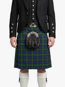 Person wearing a Scottish kilt with a sporran on a white background