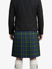Person wearing a black jacket and a green and blue plaid kilt on a white background
