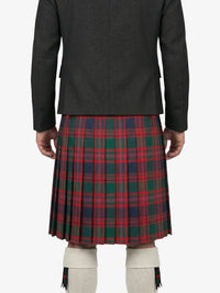 Person wearing a dark jacket and red plaid kilt on a white background