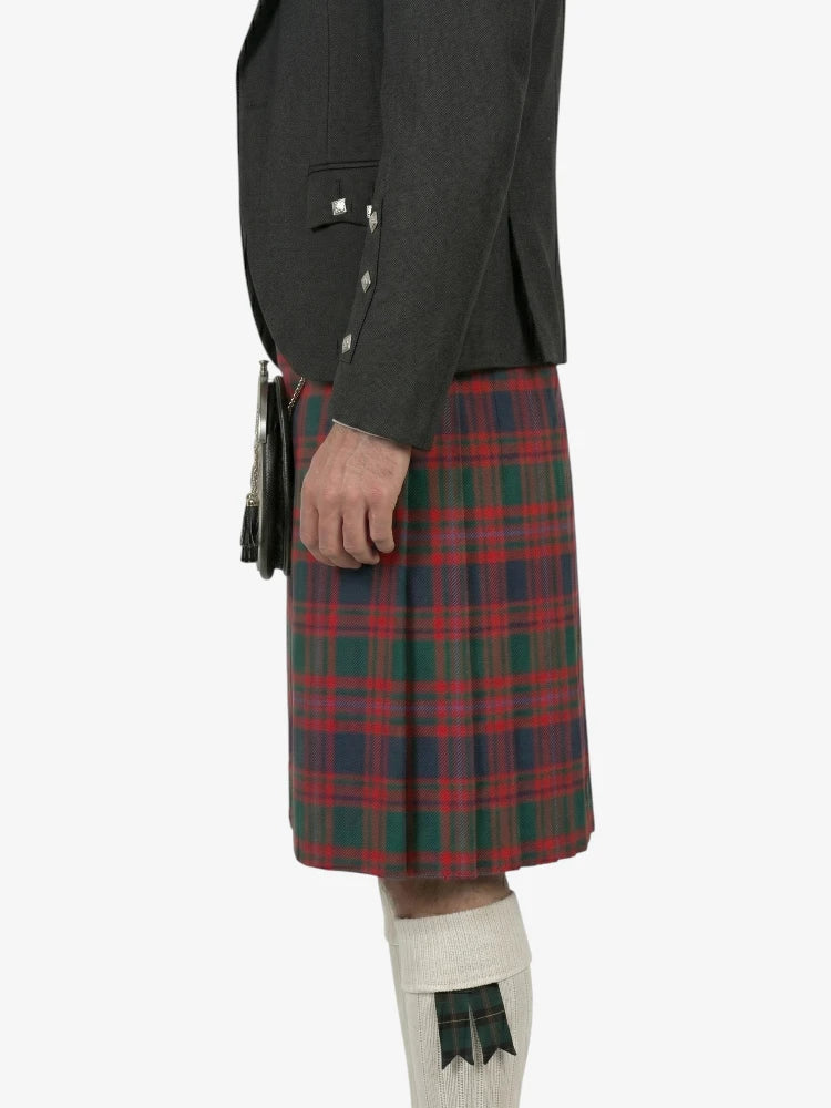 Person wearing a dark jacket and red plaid kilt on a white background