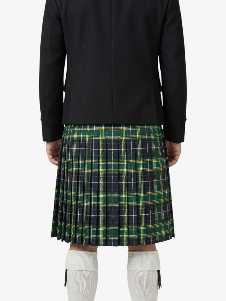 Person wearing a black coat and green plaid kilt on a white background
