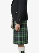 Person wearing a black blazer and green plaid kilt on a white background
