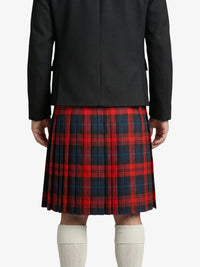 Person wearing a black jacket and red plaid kilt on a white background