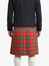 Person wearing a black jacket and red plaid kilt  on a white background