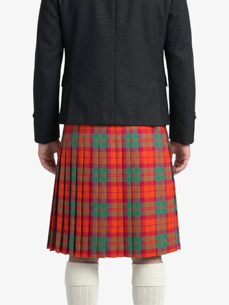Person wearing a black jacket and red plaid kilt  on a white background