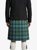Person wearing a black jacket and plaid kilt on a white background