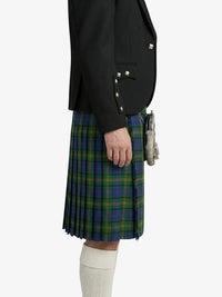 Person wearing a black jacket and green plaid kilt on a white background