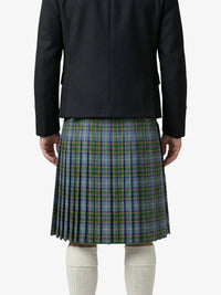 Person wearing a black jacket and plaid kilt on a white background