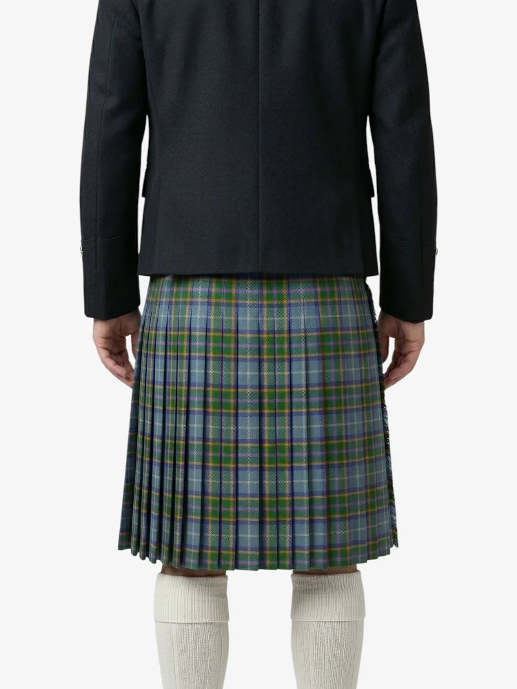 Person wearing a black jacket and plaid kilt on a white background