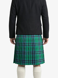 Person wearing a green plaid kilt with a black jacket on a white background