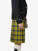 Person wearing a black jacket and yellow plaid kilt on a white background
