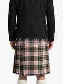Person wearing a black coat and plaid kilt on a white background