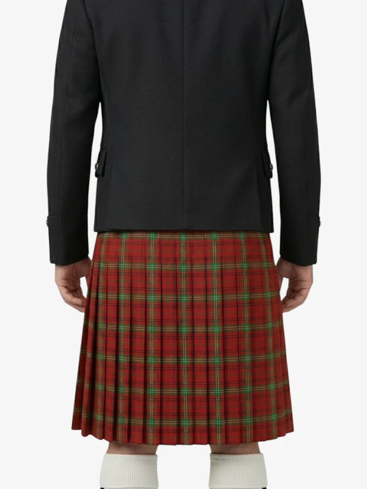 Person wearing a black jacket and red plaid kilt on a white background