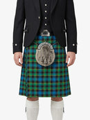 Person wearing a traditional Scottish kilt with a tartan pattern on a white background