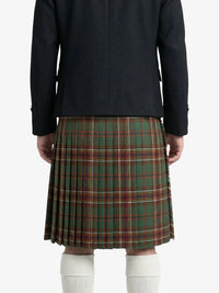 Person wearing a dark coat and green plaid kilt on a white background
