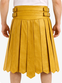 Yellow pleated skirt with belt on a white background