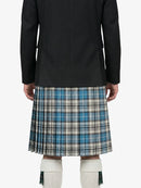Person wearing a black coat and plaid kilt on a white background