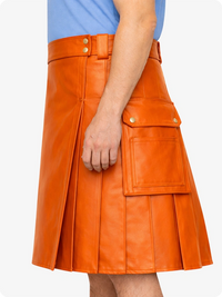 Orange leather skirt worn by a person on a white background
