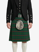 Person wearing a traditional Scottish kilt with a white background