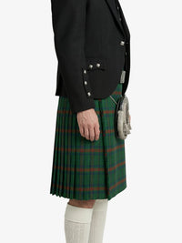 Person wearing a green plaid kilt with a black jacket on a white background