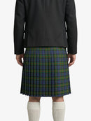 Person wearing a black coat and green plaid kilt on a white background
