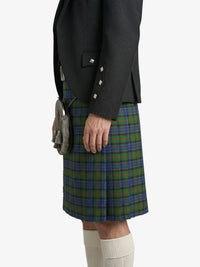 Person wearing a dark jacket and plaid kilt on a white background