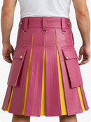 Pink and yellow pleated kilt worn by a person on a white background