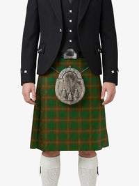 Traditional Scottish kilt with a dark jacket and white socks on a white background