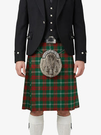 Person wearing a traditional Scottish kilt with a tartan pattern on a white background