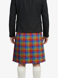 Person wearing a black jacket and colorful plaid kilt on a white background