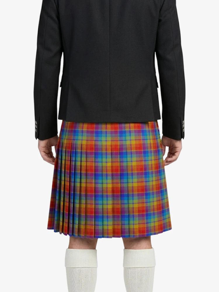 Person wearing a black jacket and colorful plaid kilt on a white background