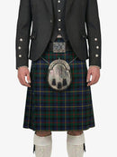 Person wearing a traditional Scottish kilt with a tartan pattern on a white background