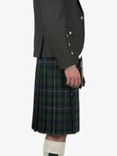 Person wearing a dark gray jacket and a plaid kilt on a white background
