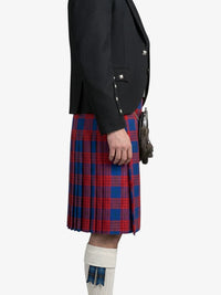 Person wearing a black jacket and red and blue plaid kilt on a white background