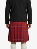 Person wearing a black jacket and red plaid kilt on a white background
