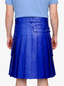 Person wearing a royal blue pleated skirt on a white background