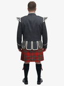 Person wearing a traditional Scottish royal stewart tartan kilt with a dark jacket on a white background