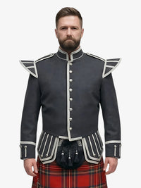 Man wearing a dark grey jacket with white trim and a royal stewart tartan kilt on a white background