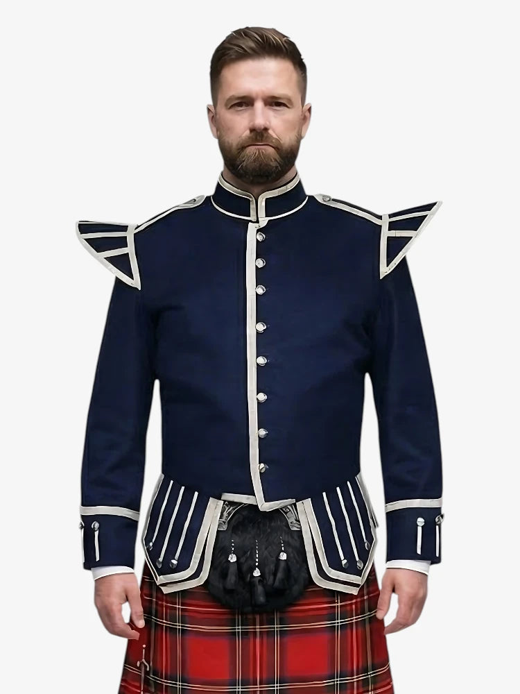 Man wearing a navy doublet jacket with white accents and a red plaid kilt on a white background